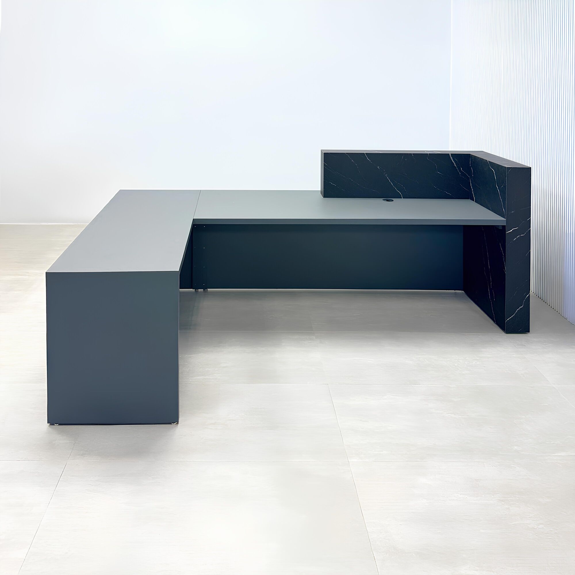 108-inch Atlanta L-Shape ADA Reception desk with gray traceless laminate desk, base, and return. Counter top and front accent in black stone palazzo.