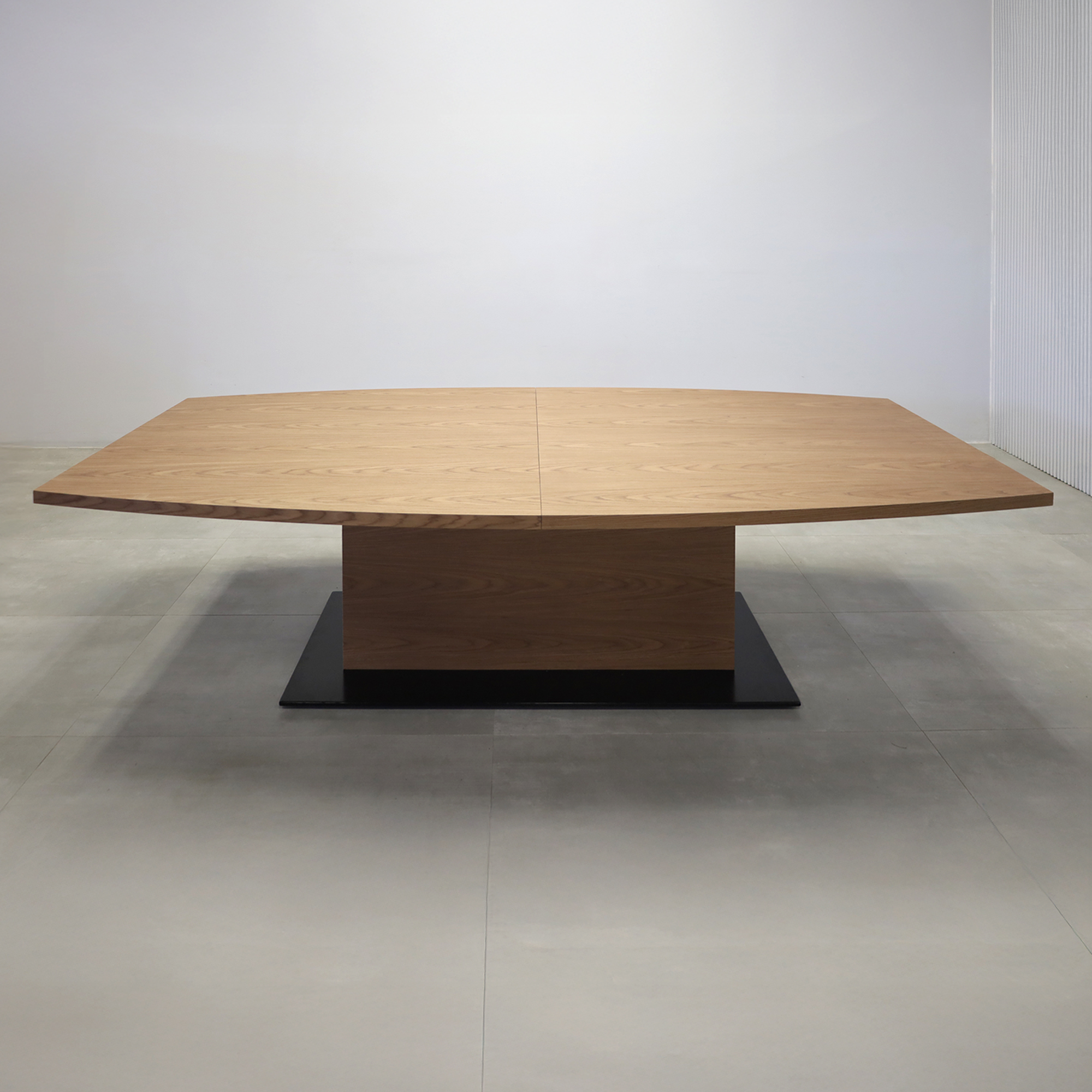108-inch Newton Boat Conference Table with Walnut Wood Veneer top, Walnut Wood Veneer pedestal, and Black Powder-Coated base.