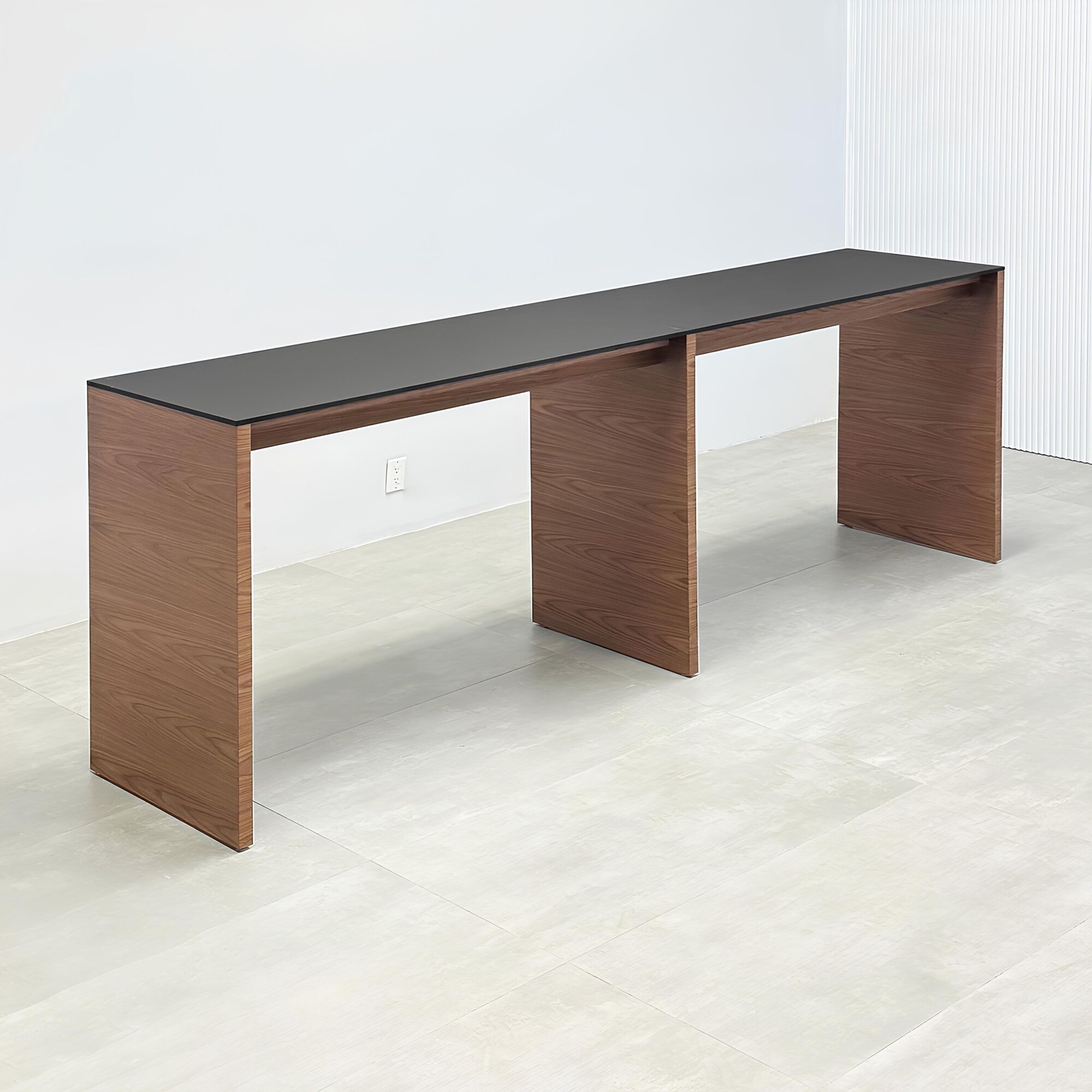 60-inch Ashville Bar Table with black, traceless laminate top and walnut wood veneer base.