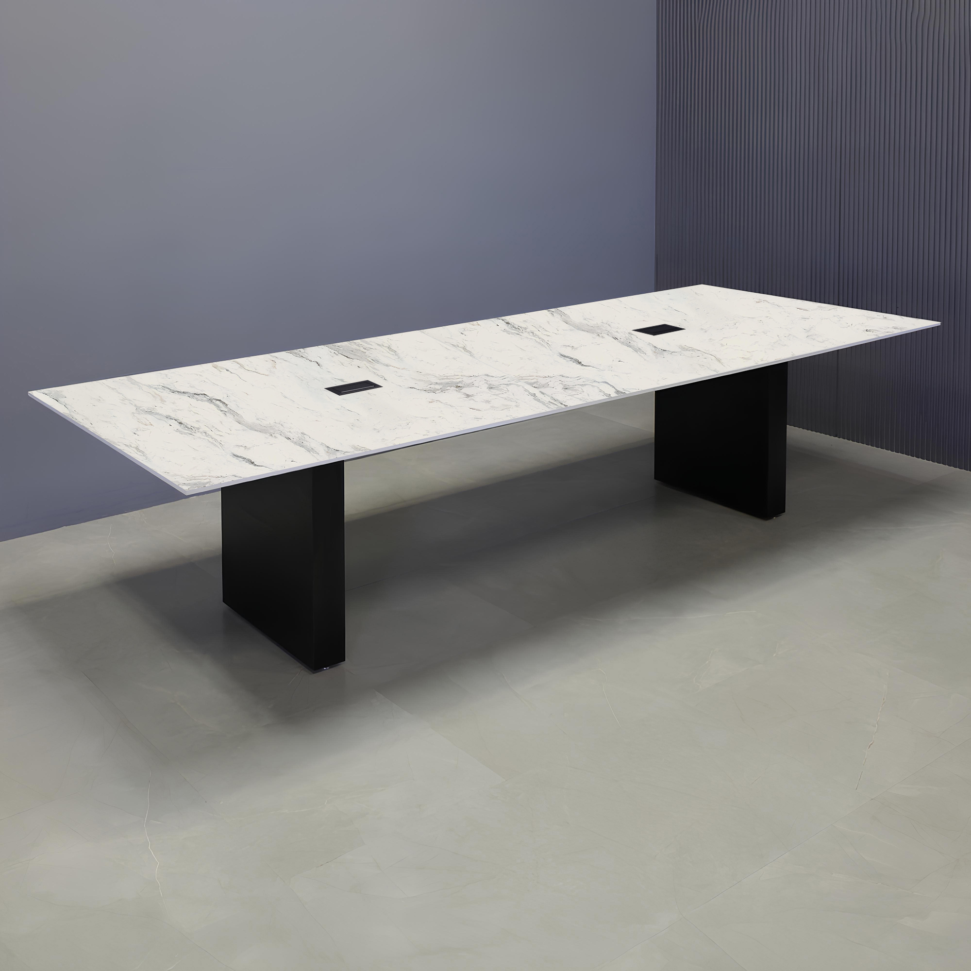 120 in x 48in rectangular table with Calcutta Blanc top, black matte base and black MX-2 power boxes