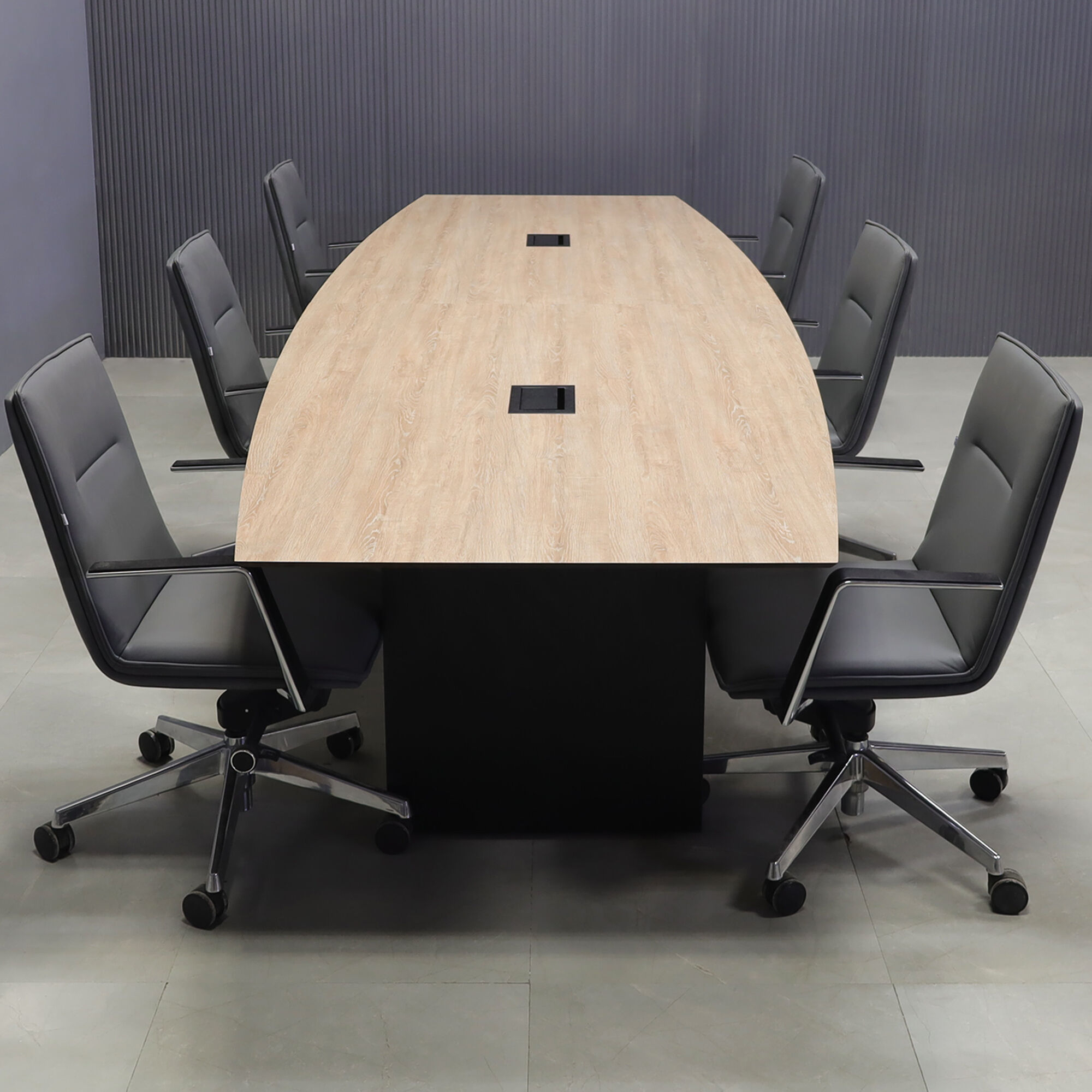 144-inch Aurora Boat Conference Table in 1/2-inch countryside oak engineered surface top, black matte laminate base, and two black MX3 power boxes.