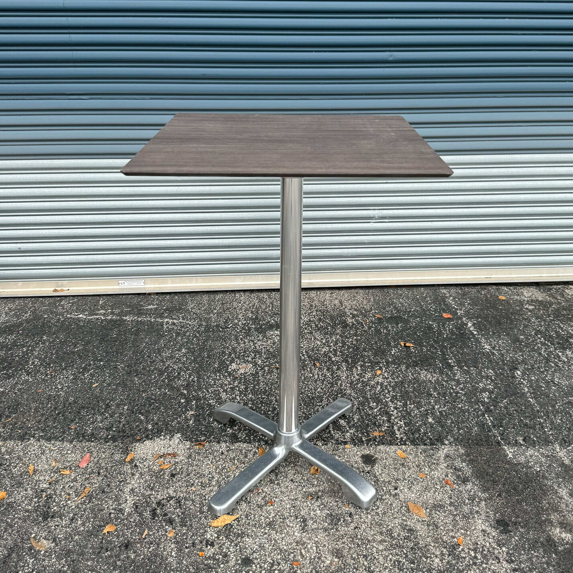 30-inch California Square Bar Table in 1/2-inch gray oak engineered surface top and FLAT SX26 silver bar base.