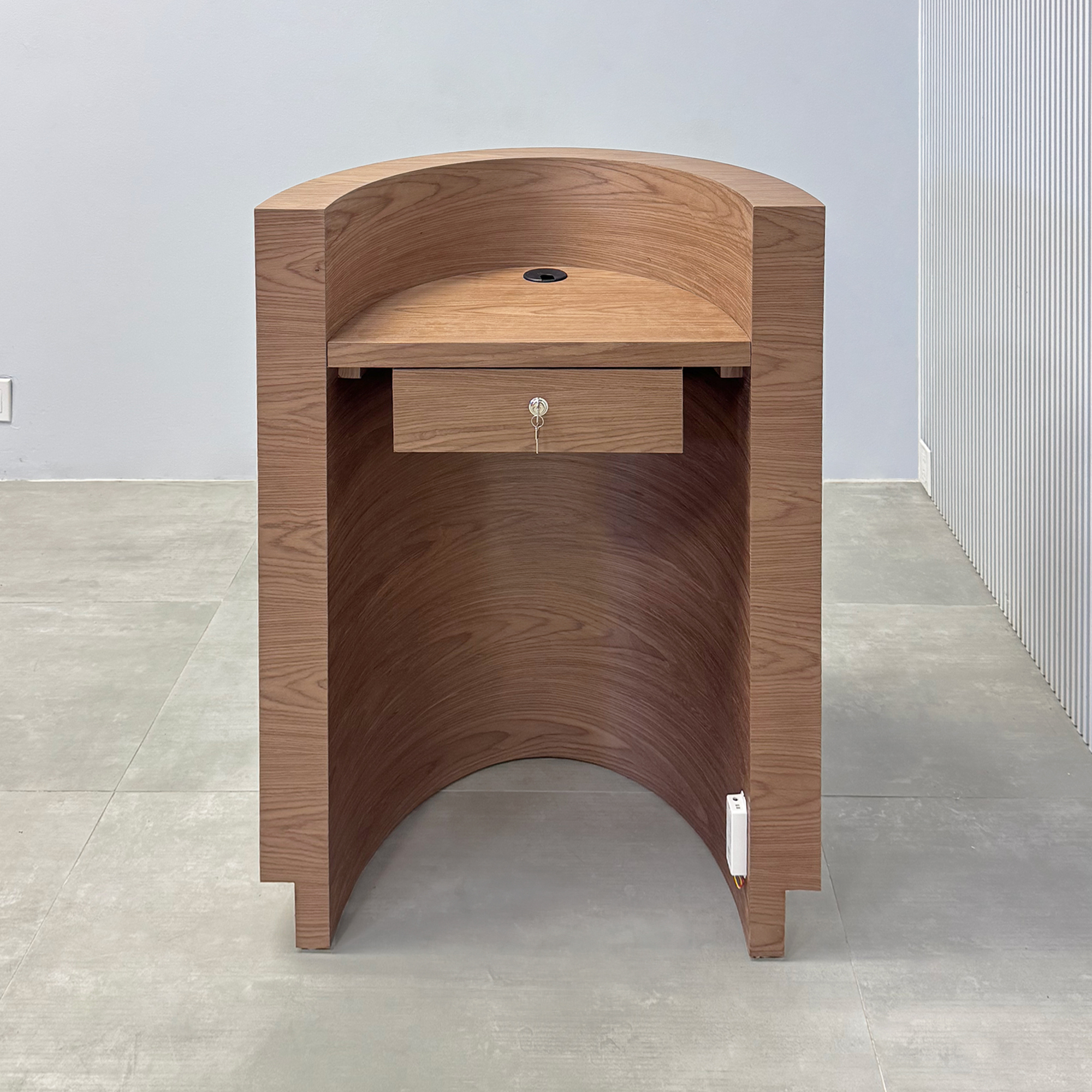 32"inch Lima Podium with Standard Walnut Wood Veneer main body, Standard Walnut Wood Veneer workspace, Gold Aluminum toe-kick, and White LED. 