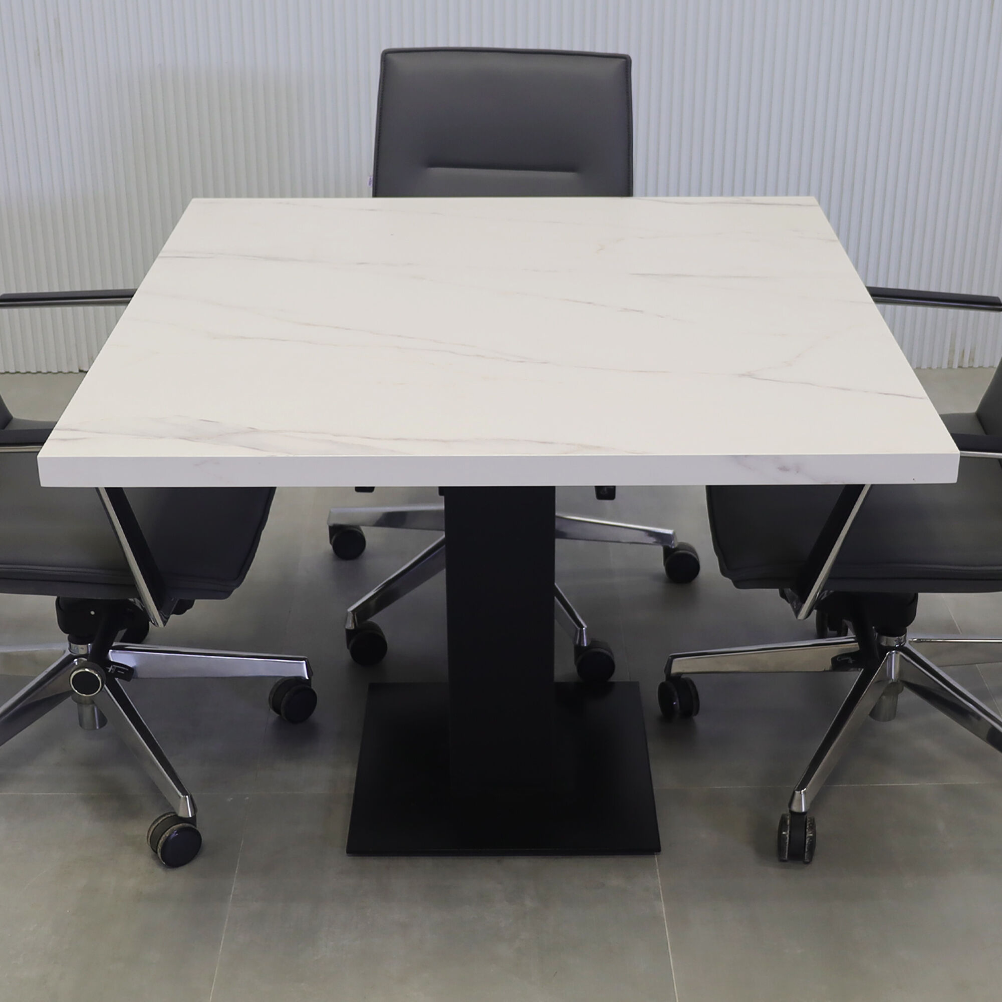 40-inch California X2 Round Conference Table in 1 1/2-inch solenne marble engineered surface top, black traceless laminate pedestal, metal powder coated base in black.