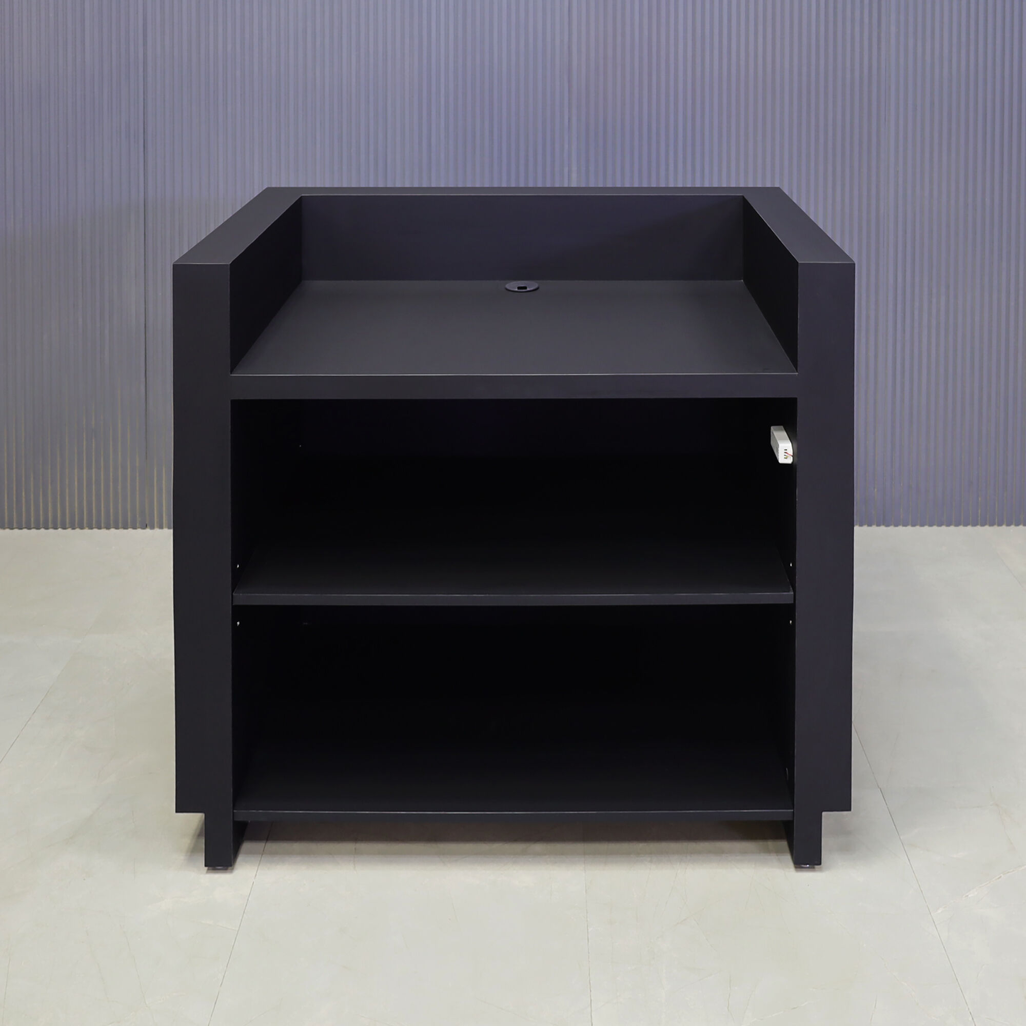 48-inch Wave Podium & Host in black traceless laminate main desk & toe-kick, and walnut veneer wave accent, with warm-white LED, shown here.