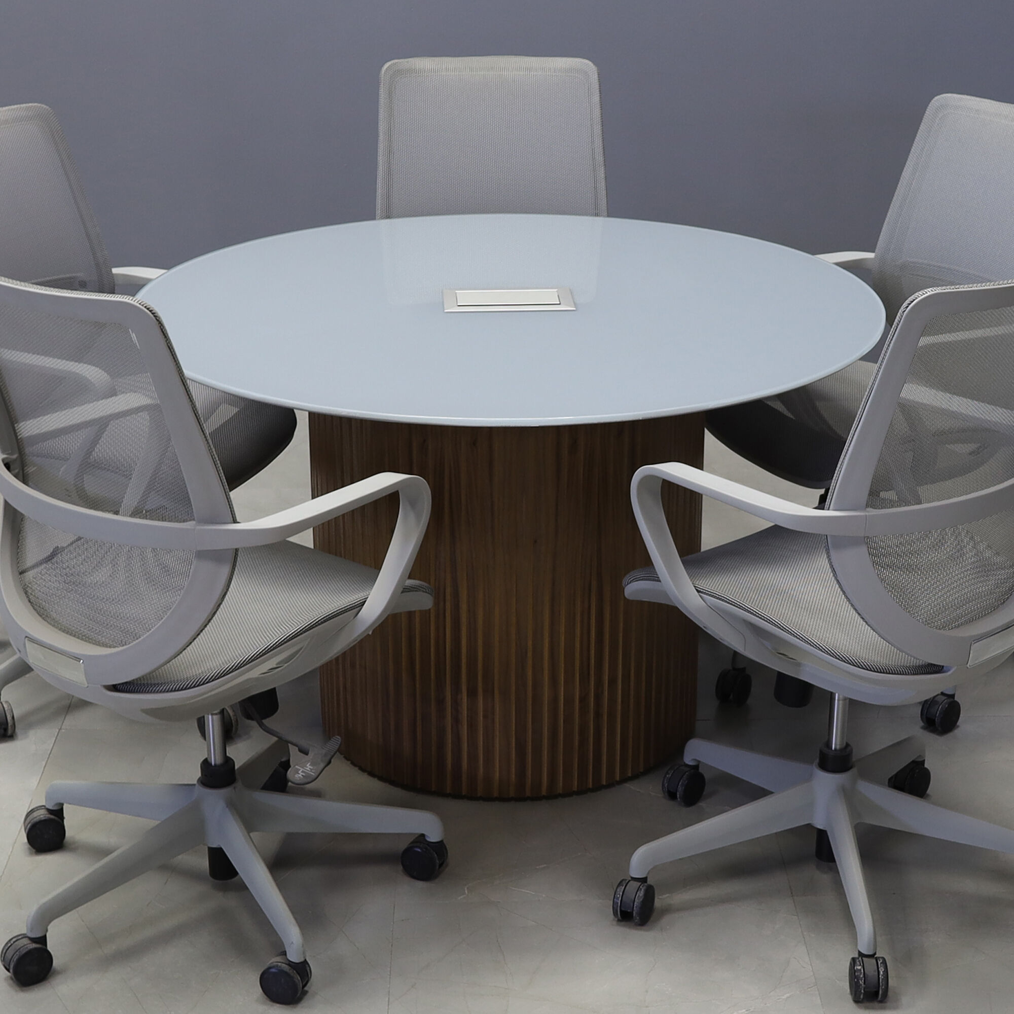 48-inch Omaha Round Conference Table in 1/2-inch light gray tempered glass top, and walnut tambour base, with silver MX3 power box.