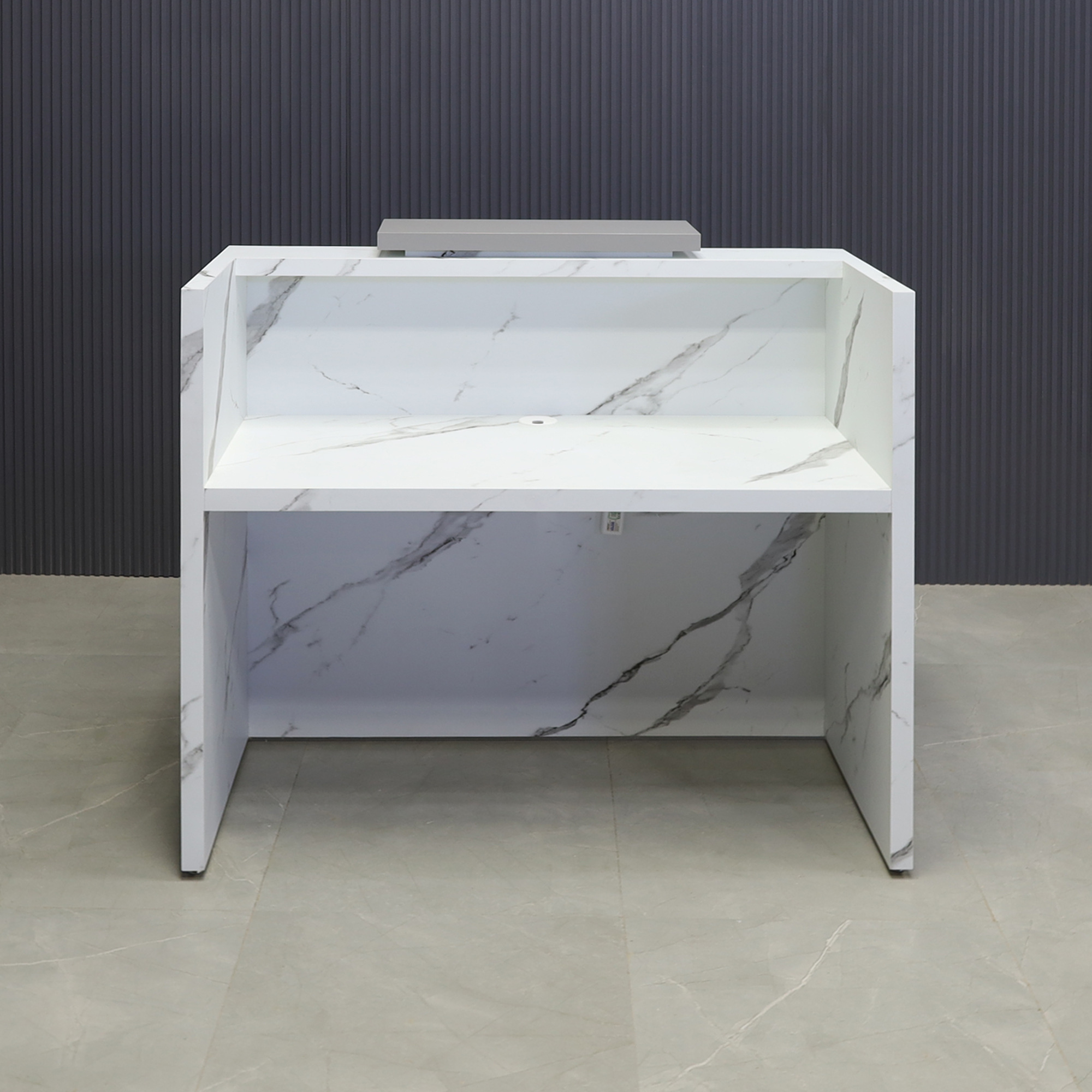 48-inch Chicago Custom Reception Desk in storm gray matte laminate counter and calcutta stone PVC desk, with color LED, shown here.