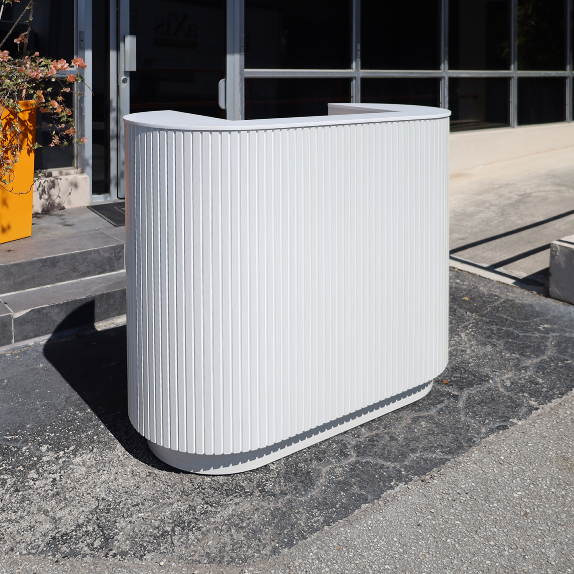48-inch The Pill X2 Podium & Host Custom Desk White Ash Tambour front, White Solid engineered surface top, White Ash matte laminate workspace and toe-kick.