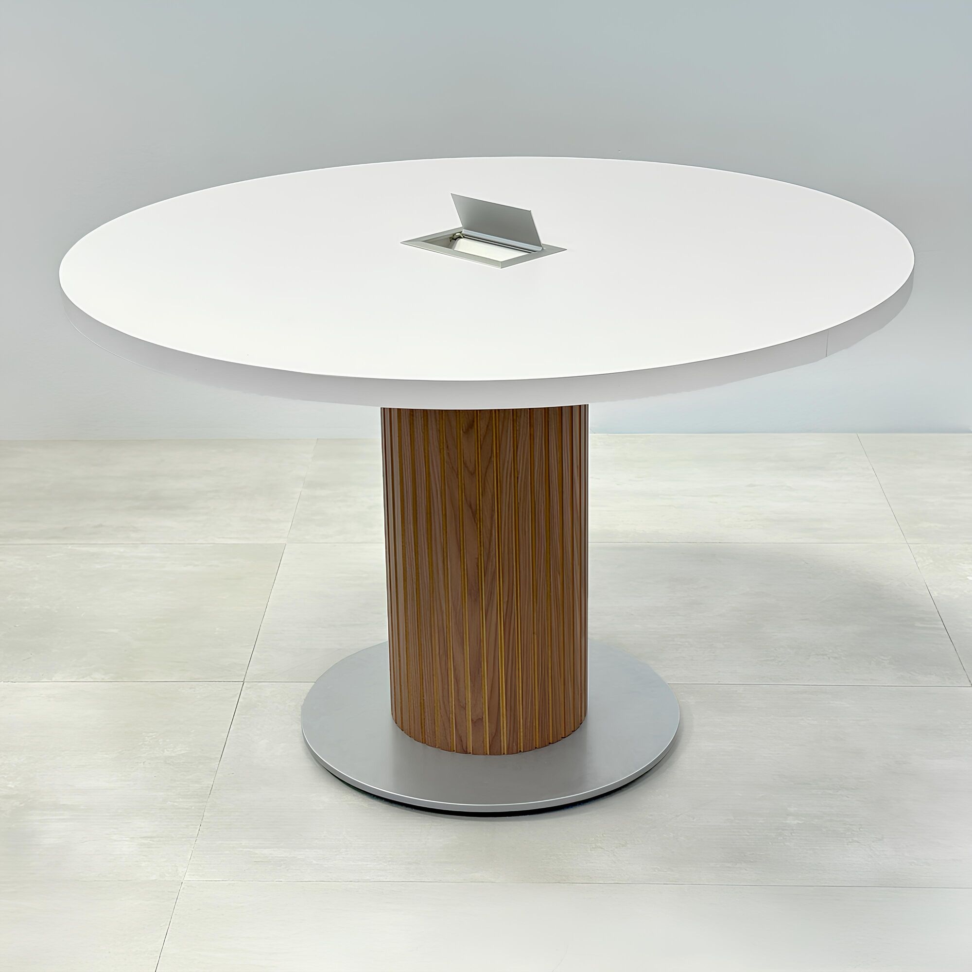 48-inch Newton Round Conference Table with X3 Base with white matte laminate top, walnut tambour with natural background, and silver powder-coated base.