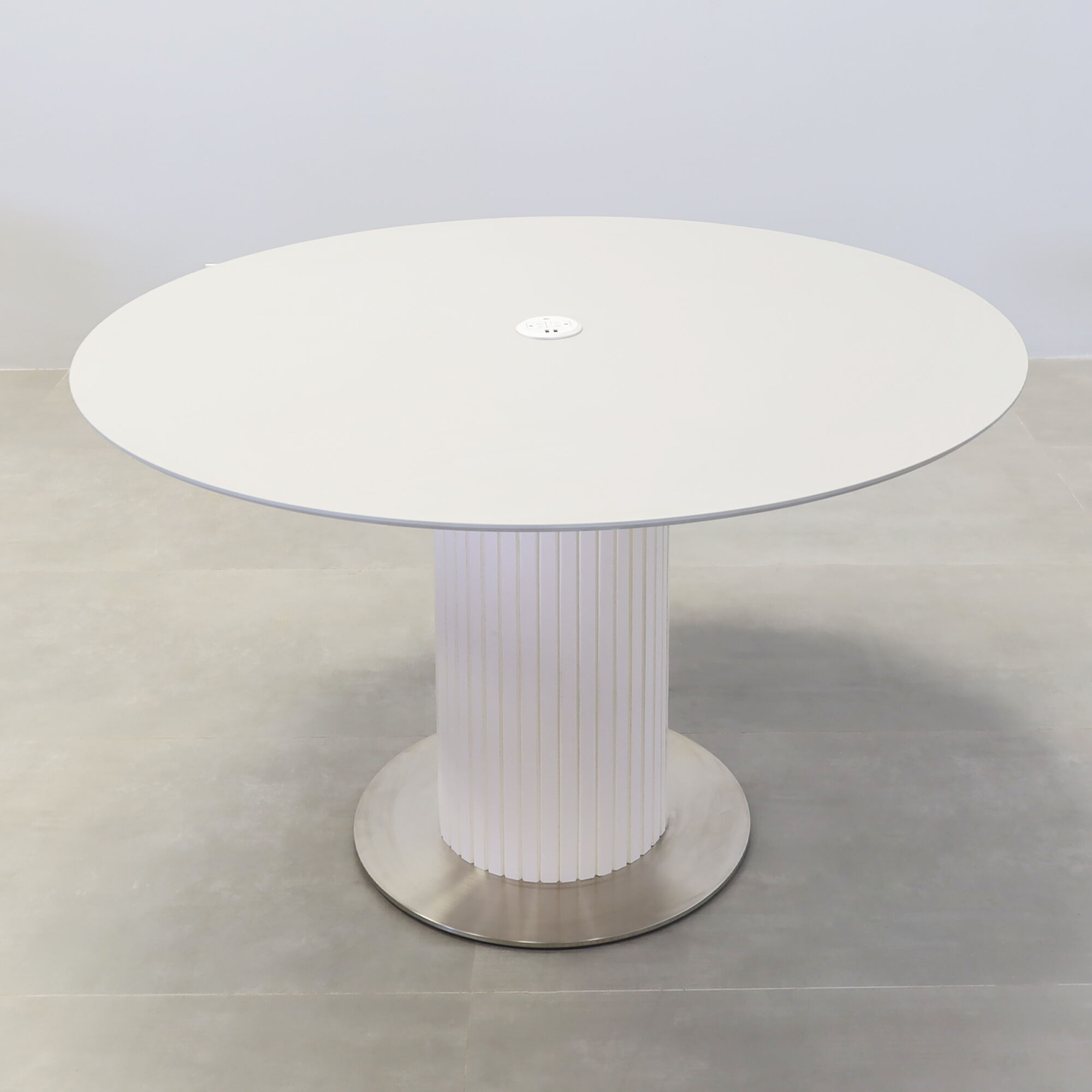 50-inch California X3 Round Conference table with light gray engineered surface top, white matte laminate tambour pedestal, silver stainless steel base, and MX1 power box.