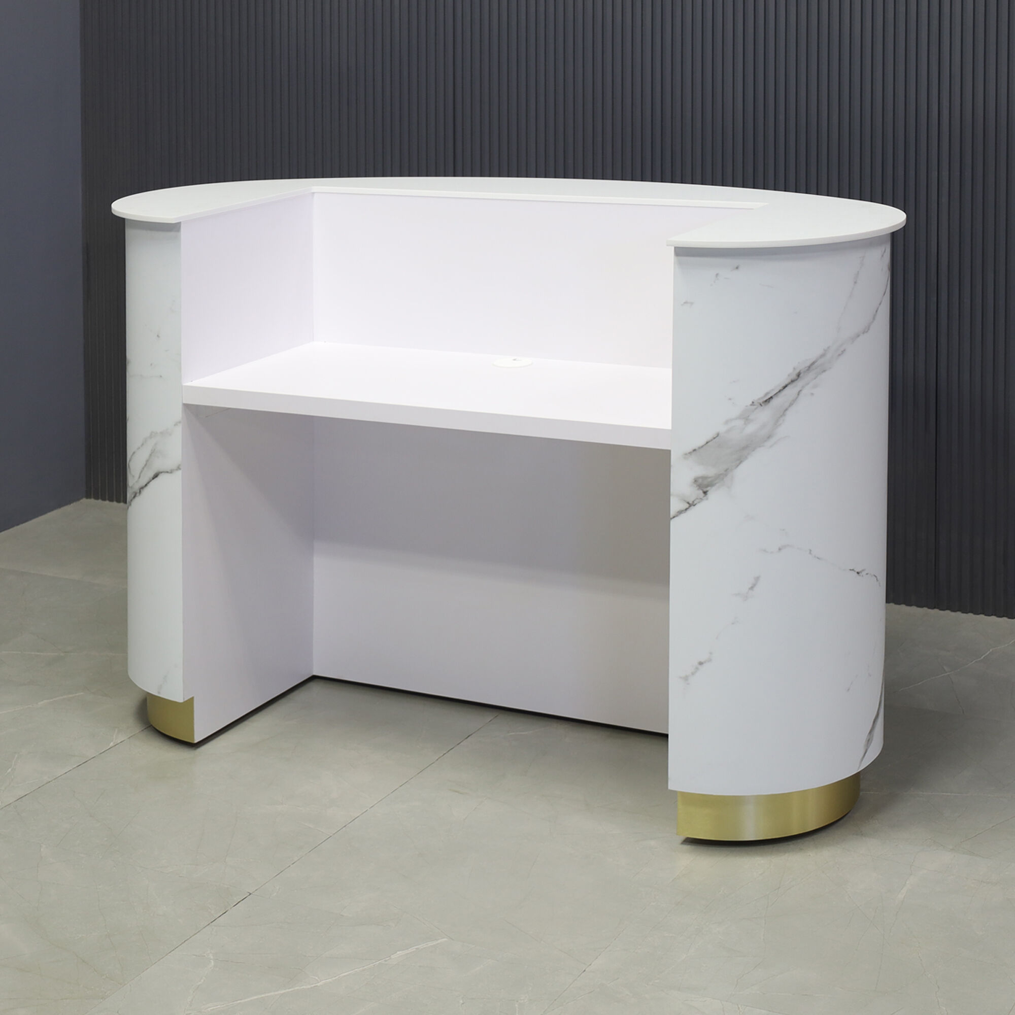 72-inch The Pill Custom Reception Desk with 1/2" white solid engineered surface top, calcutta stone pvc front panel, fog gray laminate workspace and brushed gold toe-kick, with white LED, shown here.