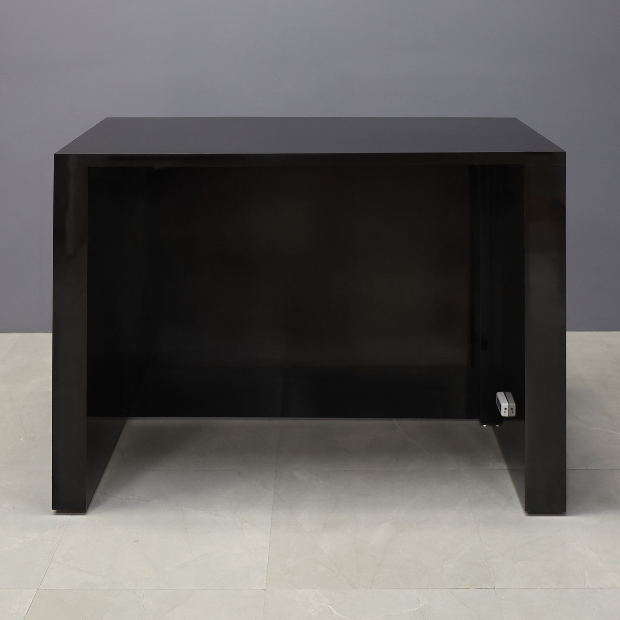 60-inch New York L-Shape Retail Custom Reception Desk in black gloss laminate desk, and color changing LED.