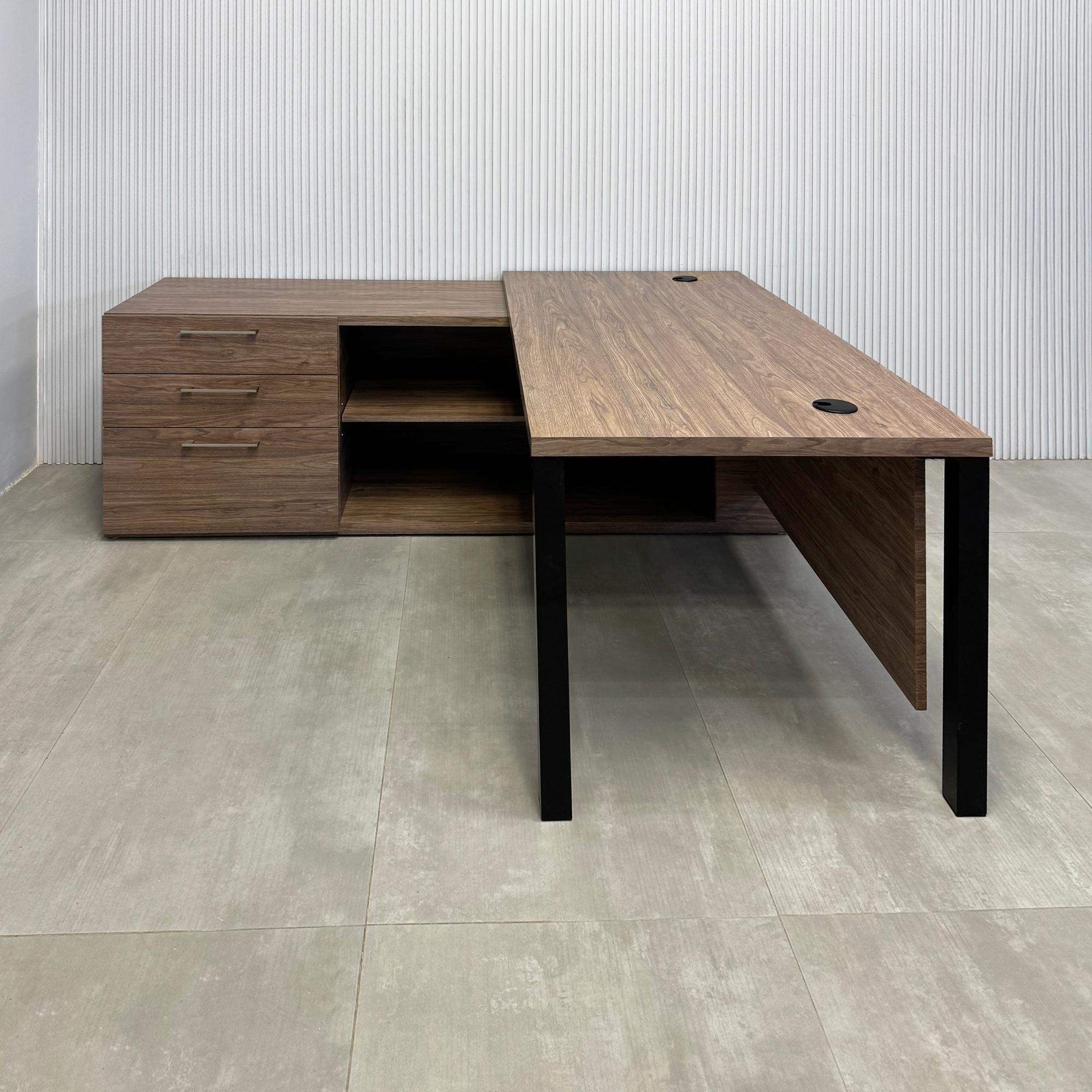 70-inch Dallas L-Shape Executive Desk with Spiced Chestnut Matte laminate top, Spiced Chestnut  Matte laminate base & storage, and black stone palazzo laminate panel.