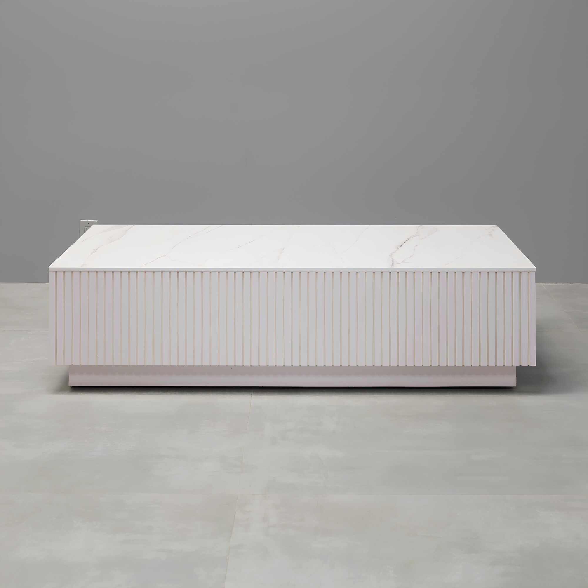 Norfolk Rectangular Lobby Table in solenne engineered surface top, white gloss tambour side table, and white gloss laminate toe-kick.