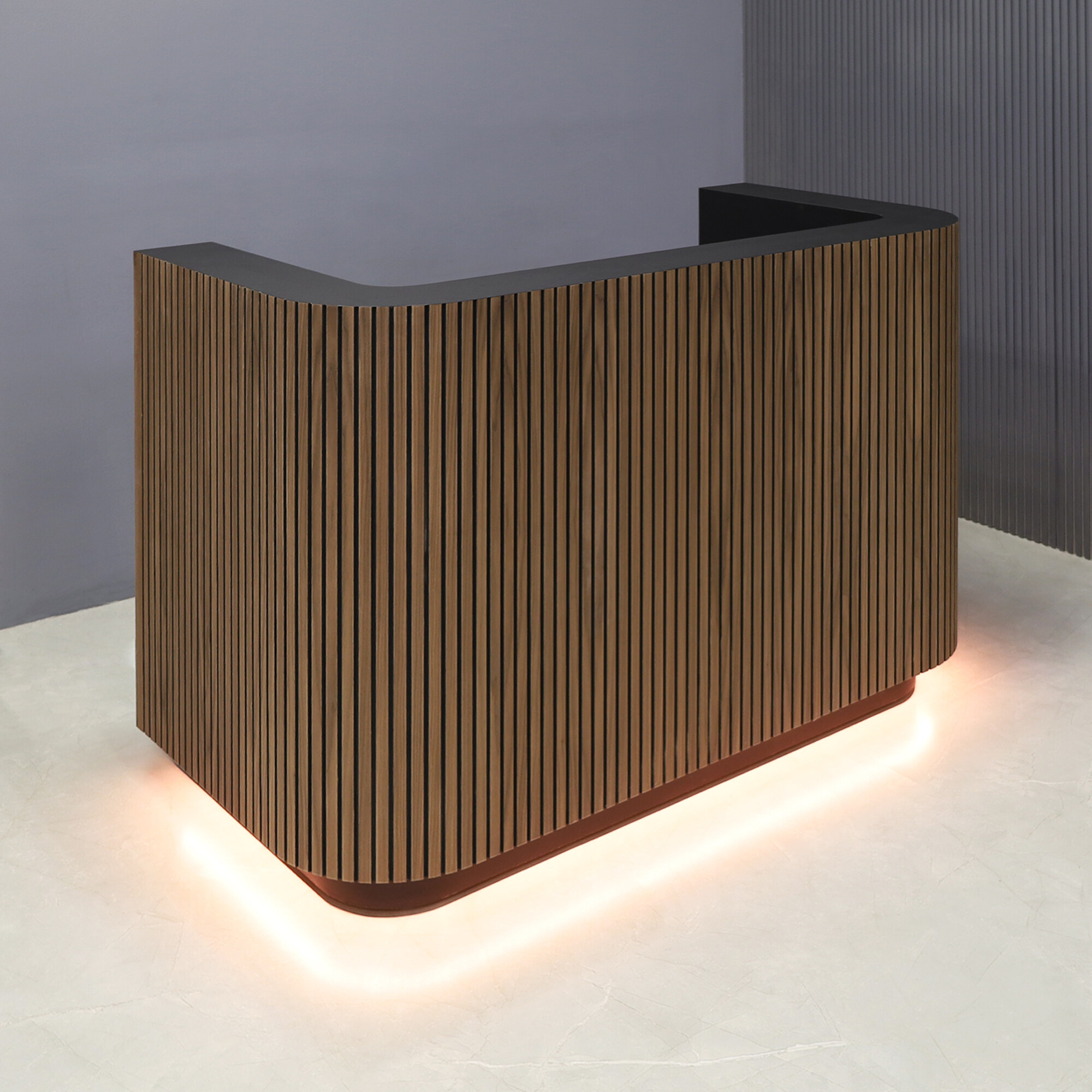 60-inch Nola Custom Reception Desk in walnut & black tambour main desk, black traceless laminate workspace & toe-kick, and warm white LED.