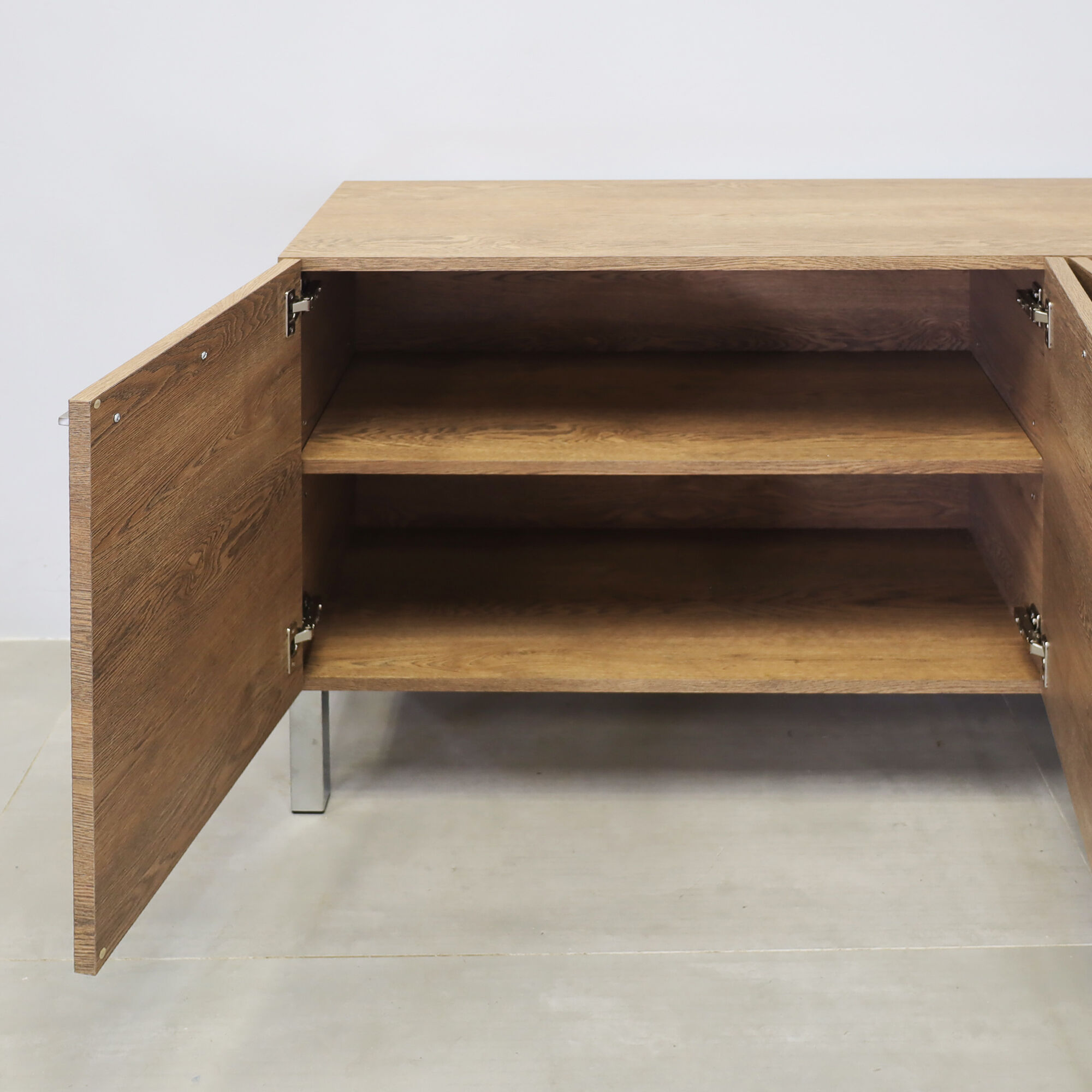 69 ½-inch Naples Custom Storage Credenza with fisher oak laminate credenza & doors, and metal legs.