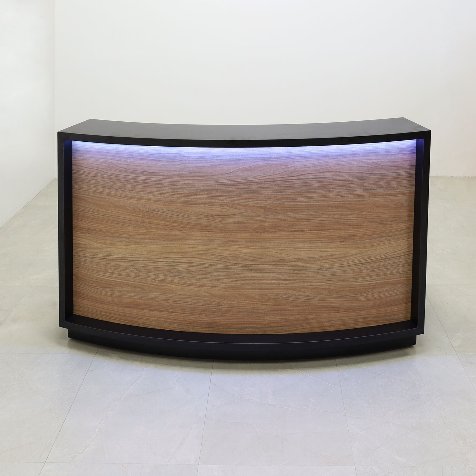 72-inch Seattle X2 Reception Desk in Black Matte Laminate Desk and Uptown Walnut Front Panel, with colored LED, shown here.