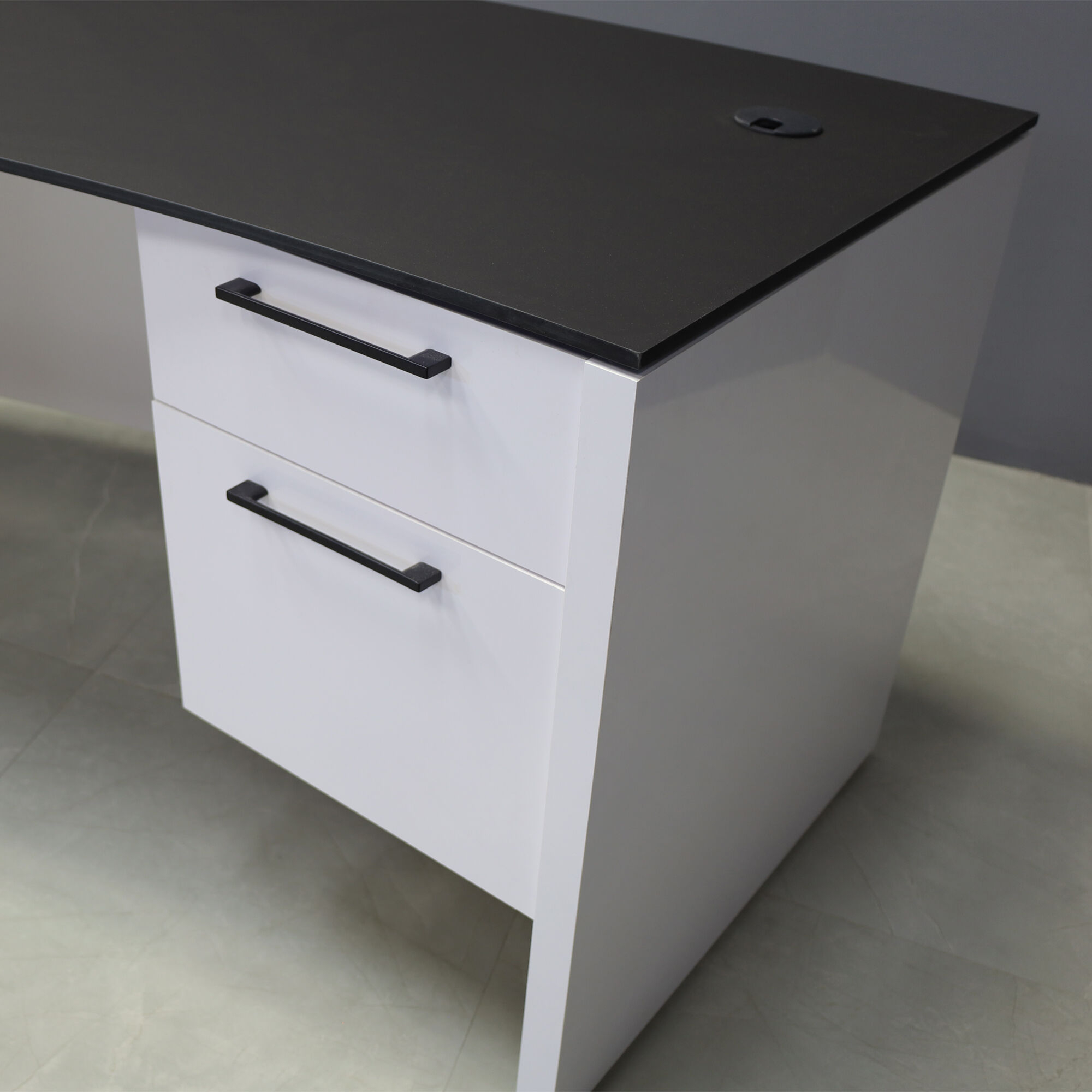 72-inch Seattle Curved Executive Desk with 1/2" Black traceless engineered surface top and white gloss laminate base & storage, shown here.