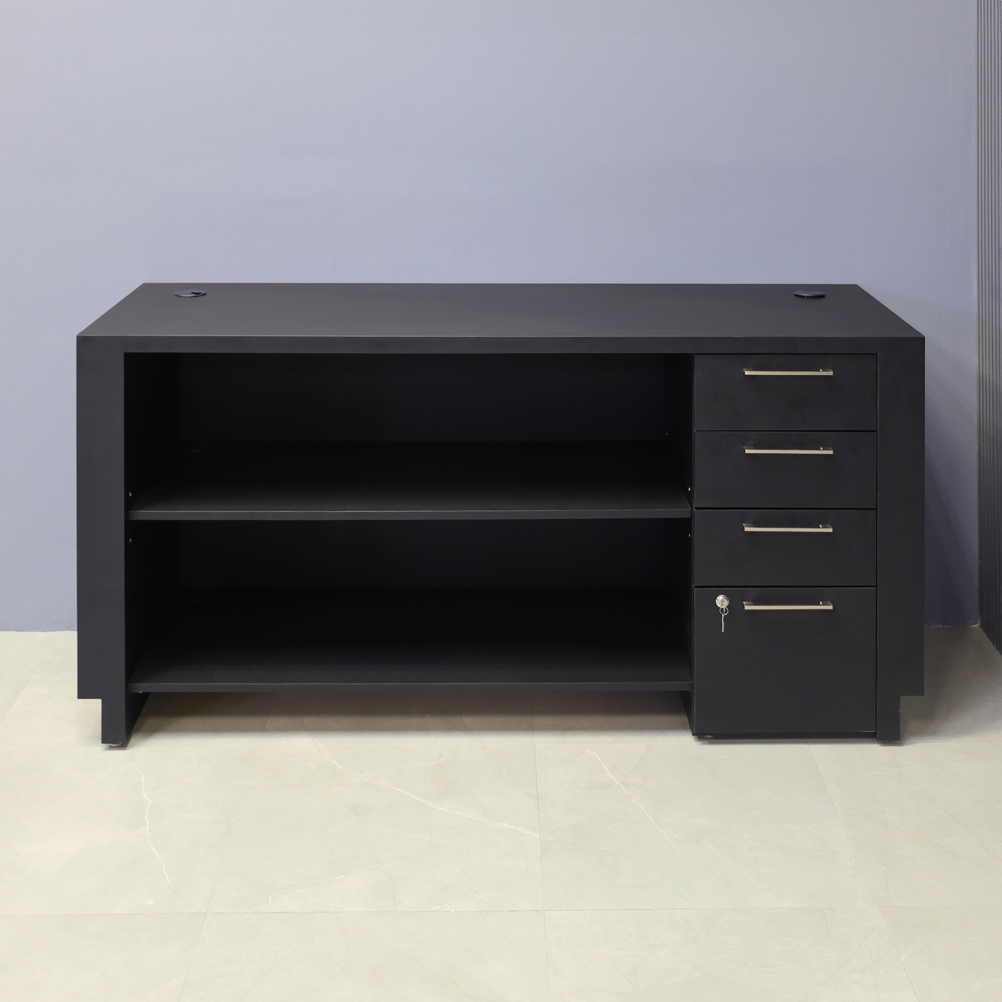 72-inch Houston Retail Custom Reception Desk in black traceless laminate main desk and brushed aluminum toe-kick. Built-in storage on the right side when sitting, one adjustable shelf, and one fixed shelf.
