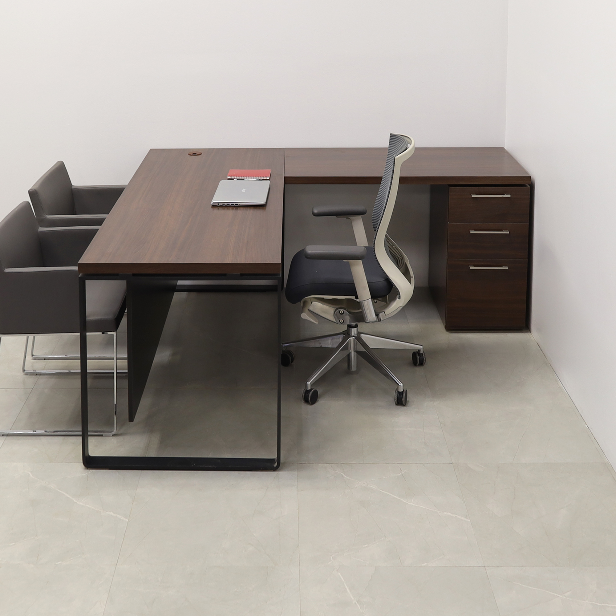 72 inches Aspen L-Shape W/ Cabinet Executive Desk In Colombian Walnut Laminate Top and storage with two pencil drawers and one file cabinet. Black matte laminate privacy panel and black stainless metal legs shown here.