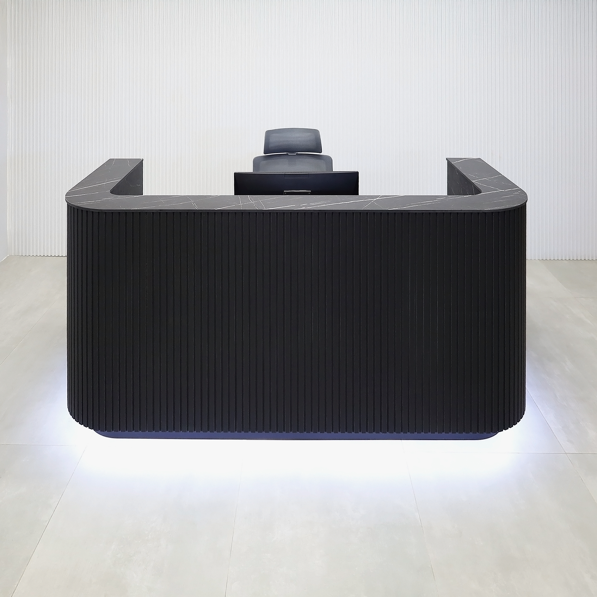 72-inch Nola Reception Desk with Pietra Noir engineered surface countertop, Black Traceless tambour main, Black Stone Palazzo laminate workspace, and Warm White LED.