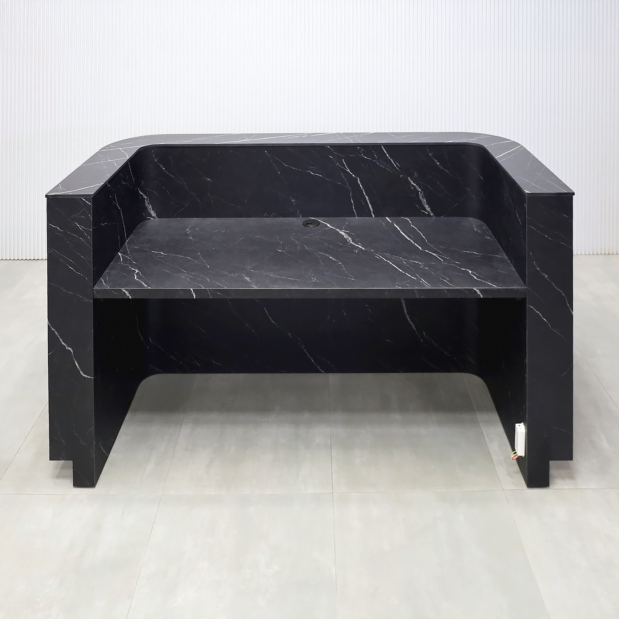 72-inch Nola Reception Desk with Pietra Noir engineered surface countertop, Black Traceless tambour main, Black Stone Palazzo laminate workspace, and Warm White LED.