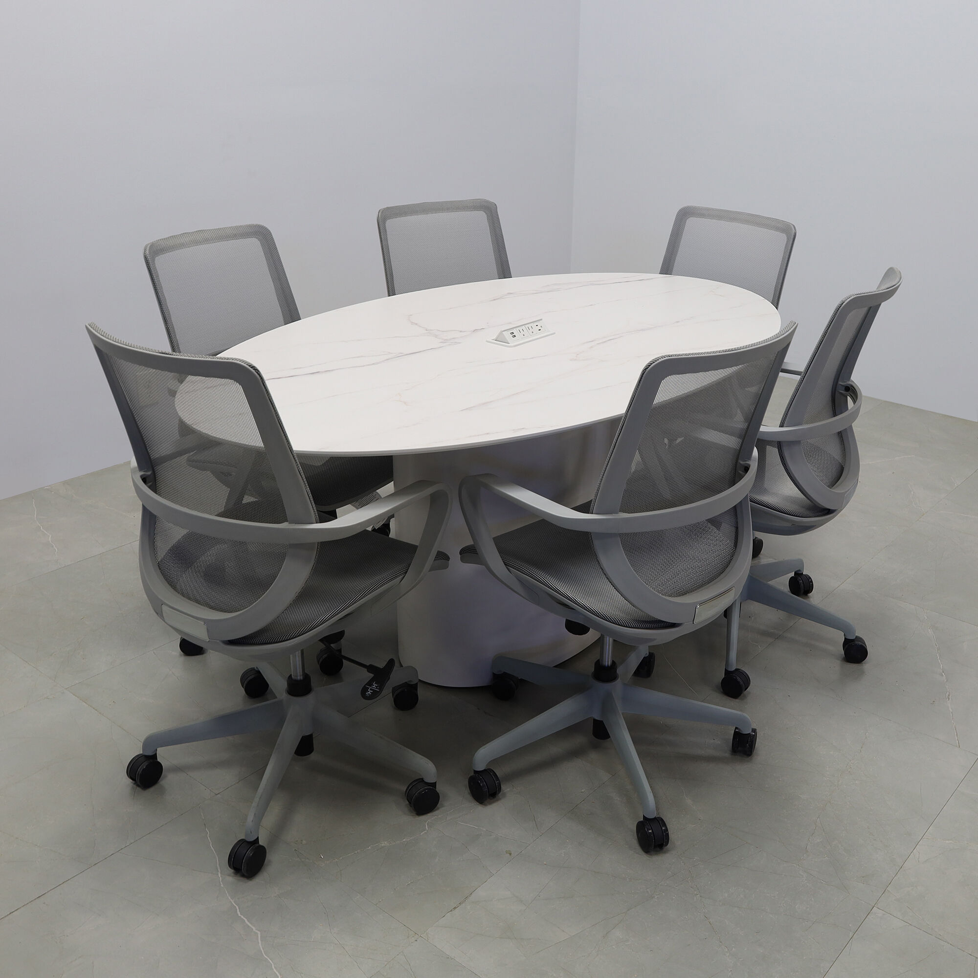 72-inch Aurora Oval Conference Table in 1/2-inch solenne marble engineered surface top, white matte laminate base, and white power box.