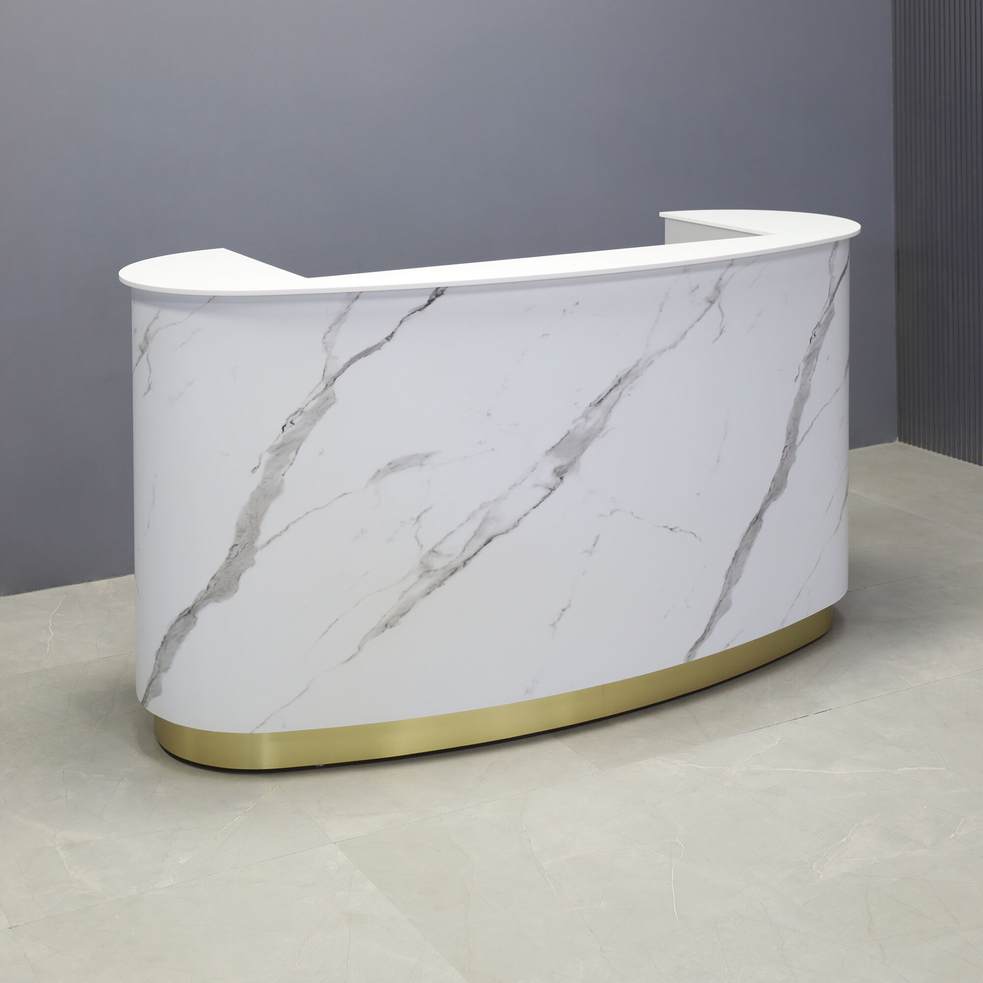72-inch The Pill Custom Reception Desk with 1/2" white solid engineered surface top, calcutta stone pvc front panel, fog gray laminate workspace and brushed gold toe-kick, with white LED, shown here.
