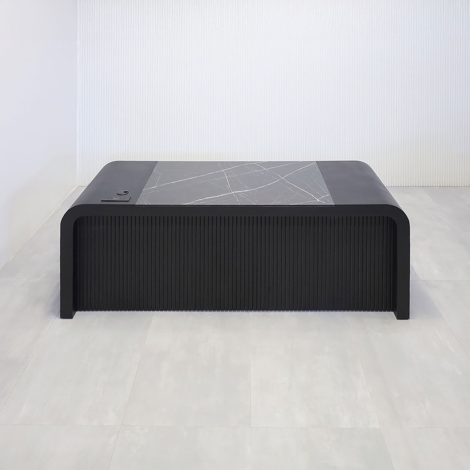 84-inch Milano Executive Desk with Pietra Noir engineered surface top, Black Cinder matte laminate desk, Ebony tambour, and power box in Black.
