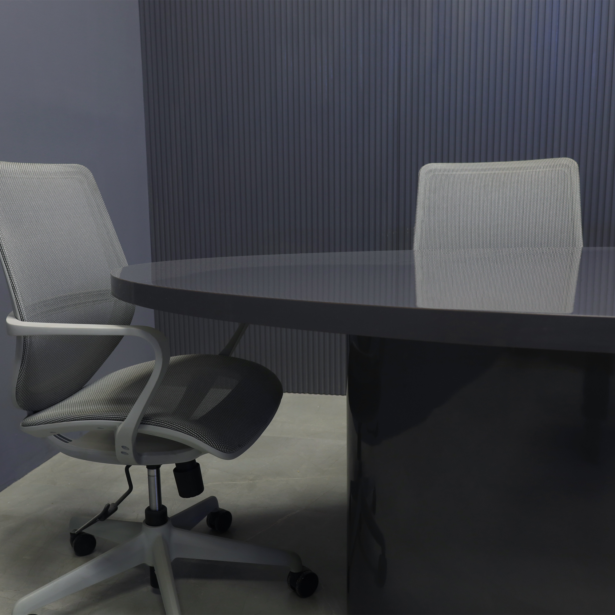 84-inch Newton Oval Conference Table With Laminate Top & base in storm gray gloss laminate, and silver MX3 power box.