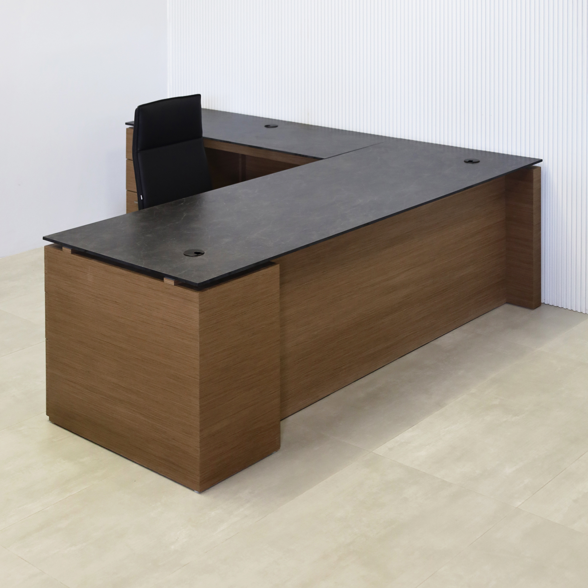 90-inch Denver L-Shape Executive Desk with Black Amani engineered surface top, Spiced Walnut wood veneer base and storage, and Spiced Walnut wood veneer panel.