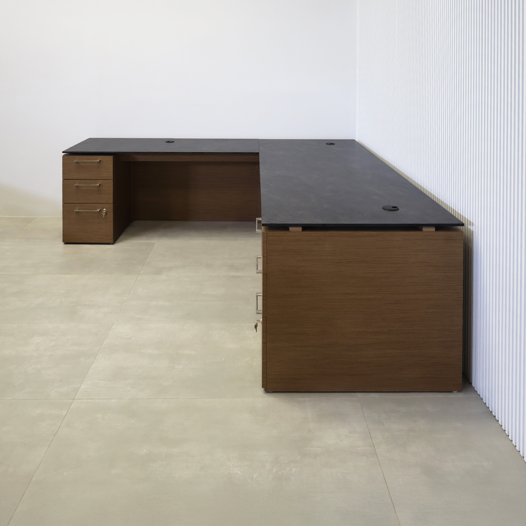 90-inch Denver L-Shape Executive Desk with Black Amani engineered surface top, Spiced Walnut wood veneer base and storage, and Spiced Walnut wood veneer panel.