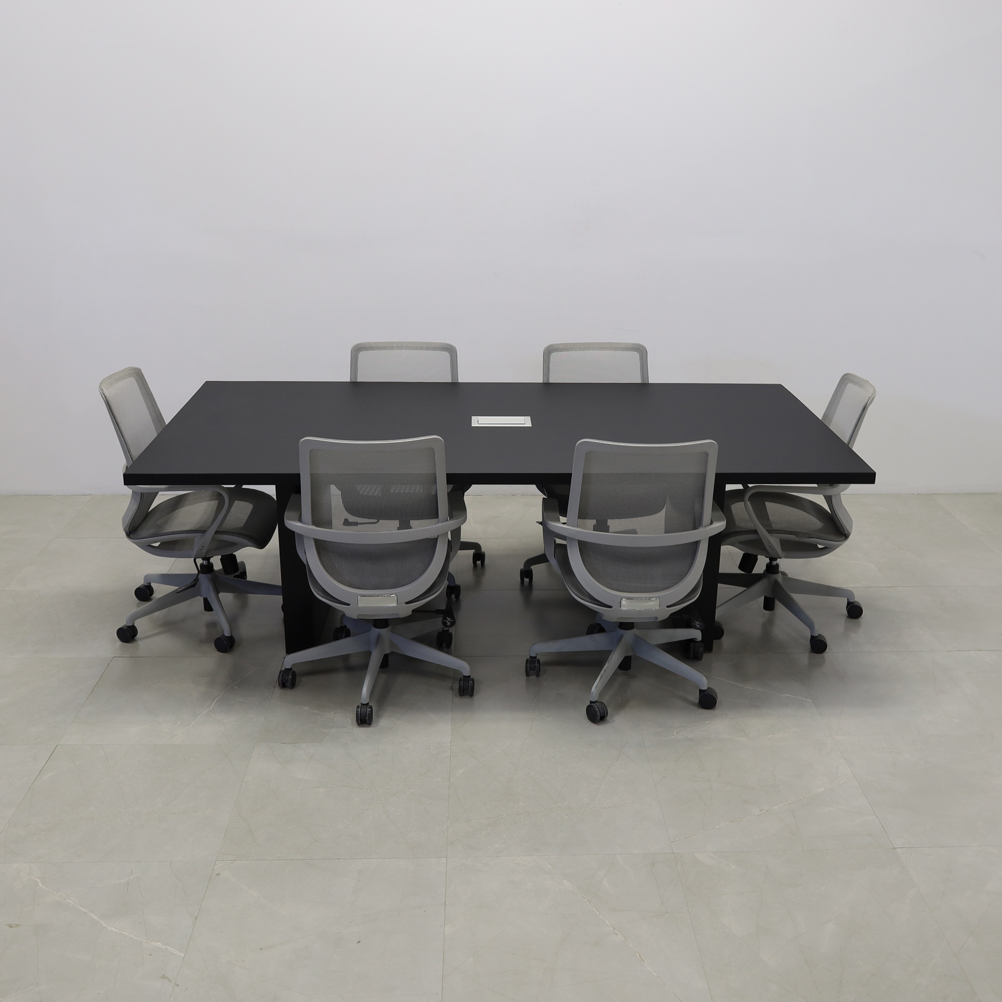 92 inches Newton Rectangular Conference Table in Black Traceless Laminate top and Black Matte Laminate base finish. Ellora power box, and six gray chairs shown here.
