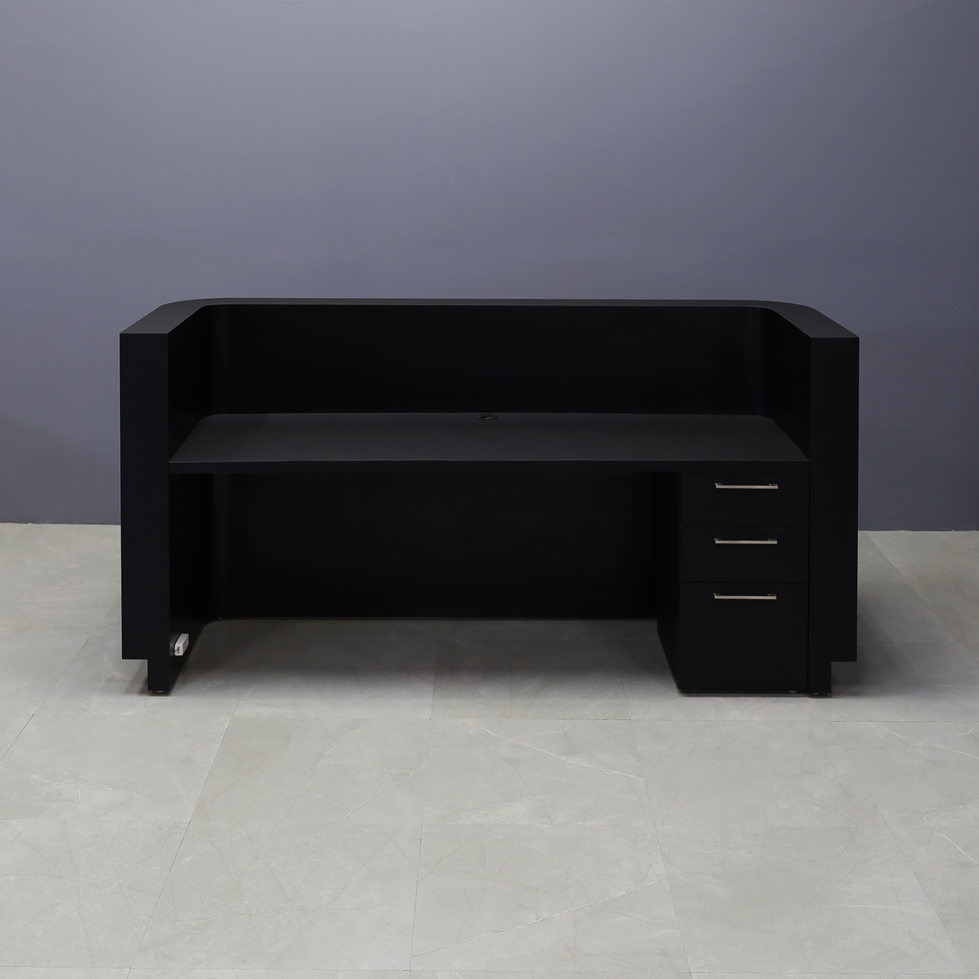 90-inch Nola Custom Reception Desk in black traceless laminate main desk, and brushed aluminum toe-kick. Built-in storage on the right side when sitting.