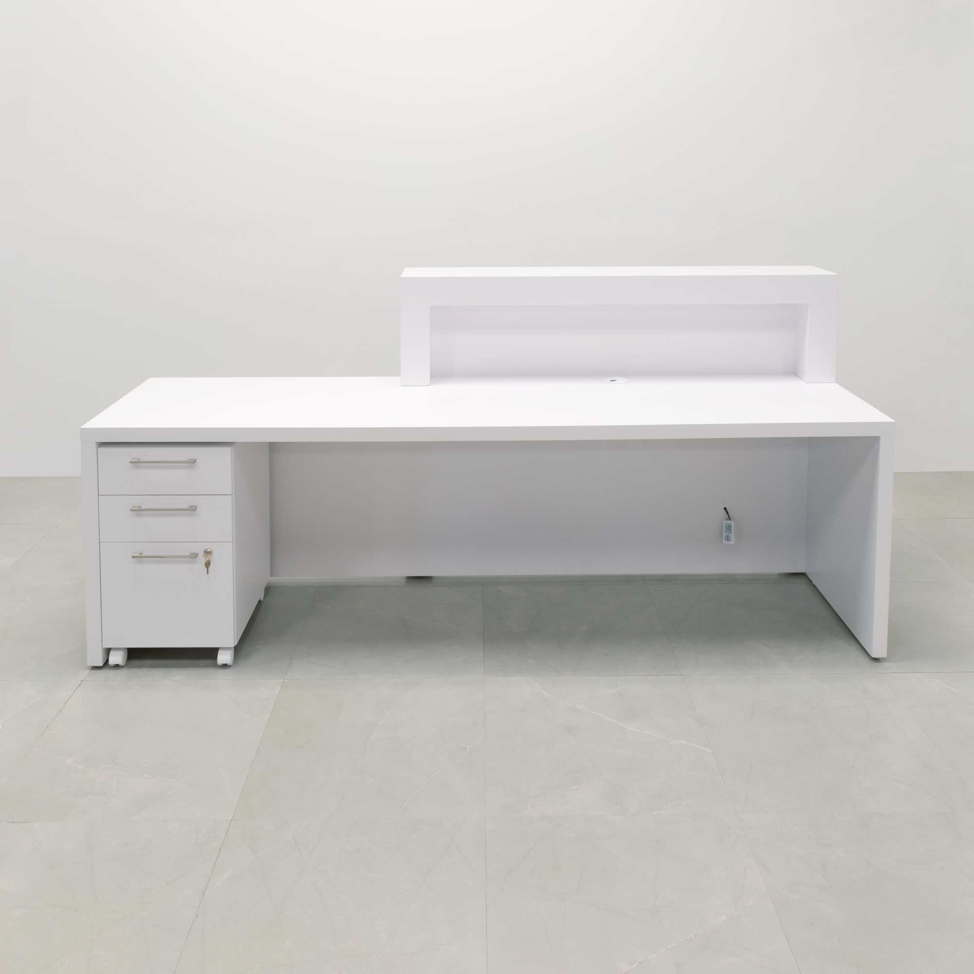 96-inch New York ADA Compliant Custom Reception Desk with the counter top side on the left side when facing front in white matte laminate main desk & front panel, storm gray gloss laminate accent recessed, and color changing LED.
