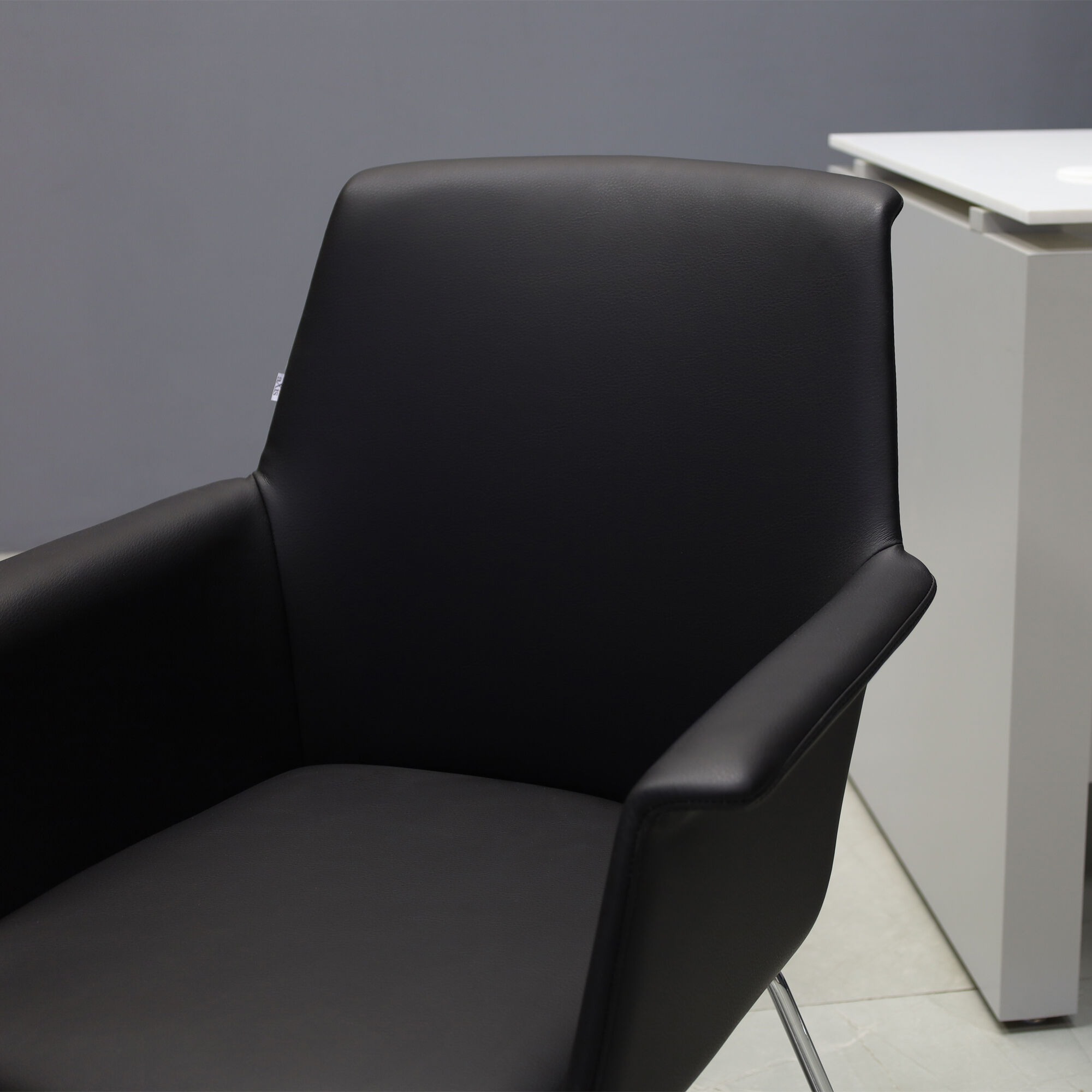 Archi Guest Chair in black upholstery, shown here.