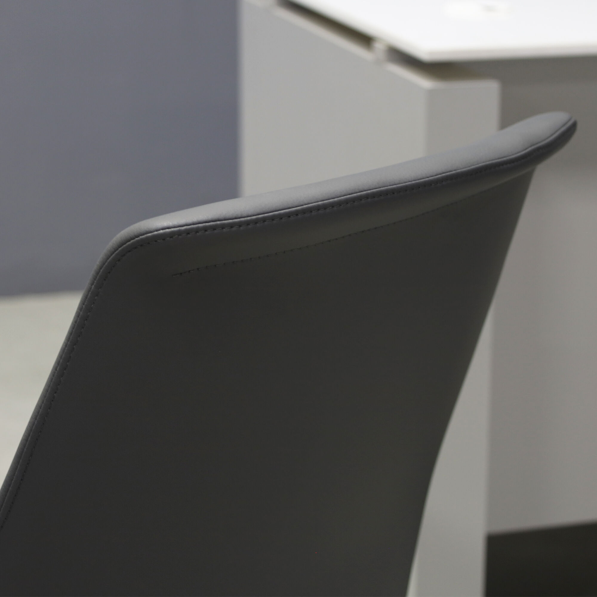 Archi Guest Chair in gray upholstery, shown here.