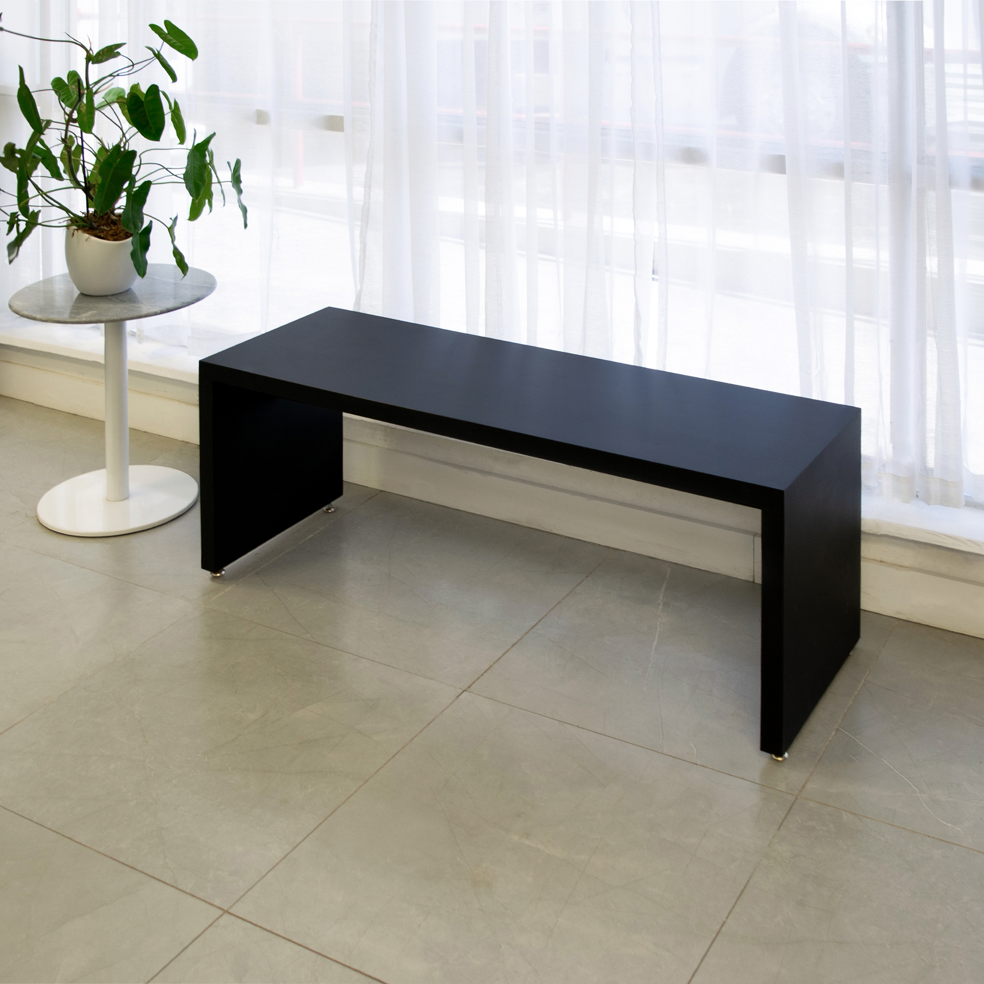 Astoria Bench in black traceless laminate finish shown here.