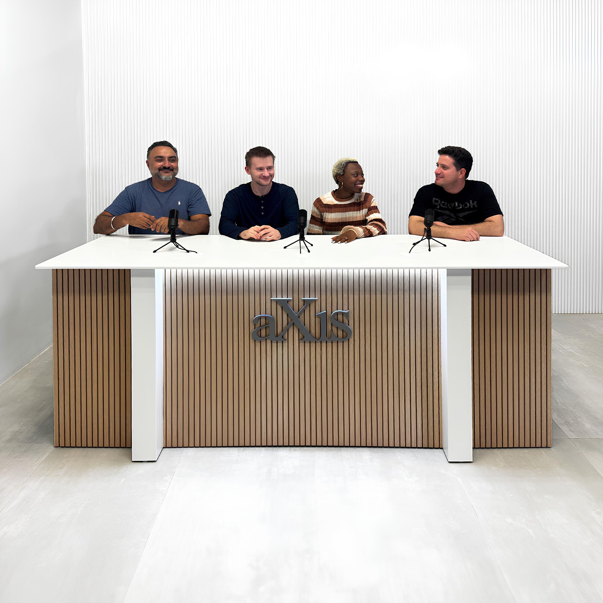 90-inch Savannah Handmade Podcast Table with white solid engineered surface top, white LED, white oak tambour front base, and dover off-white matte laminate back base.
