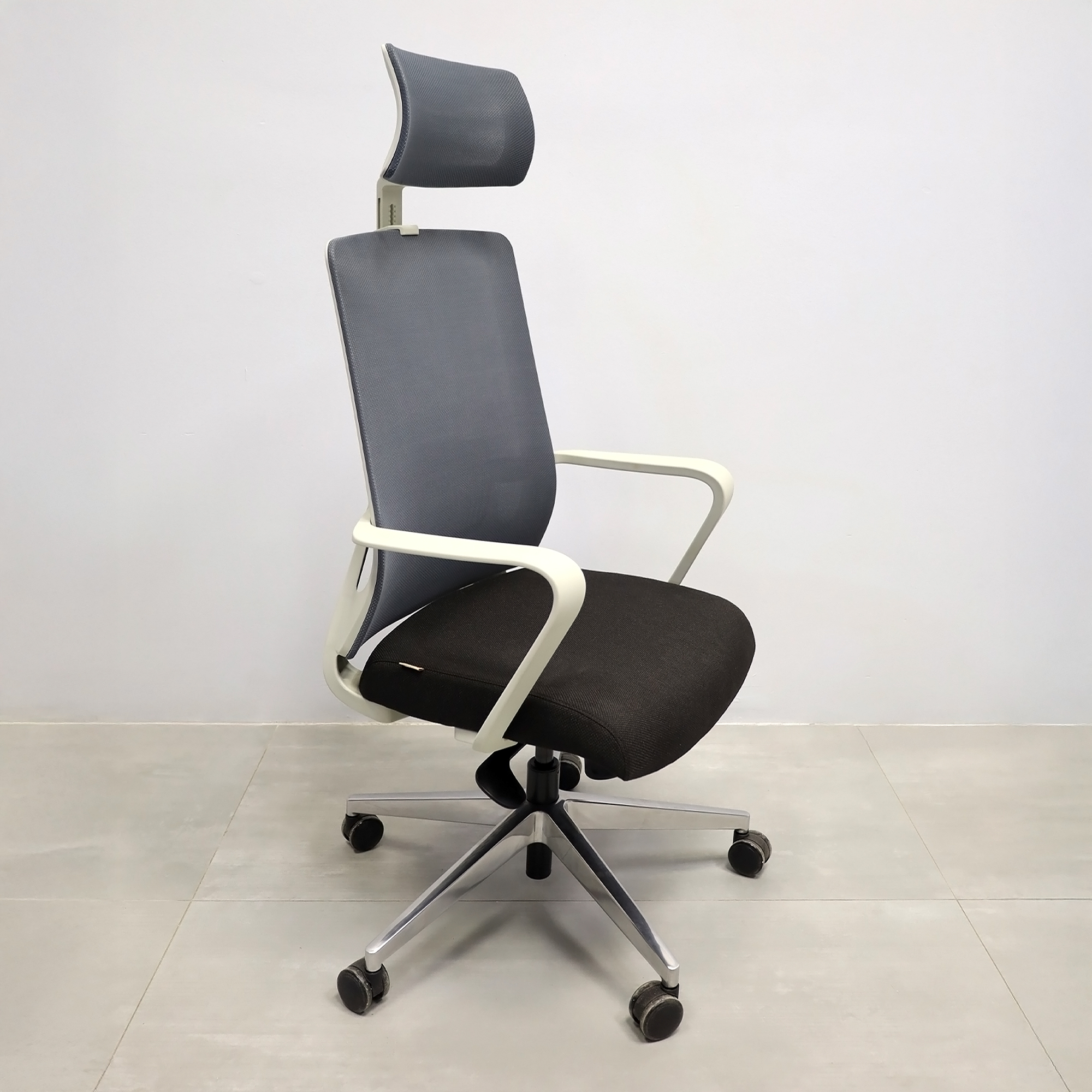 Terra Office Chair with Fixed Arms in light gray mesh back and black fabric seat cushion, shown here.