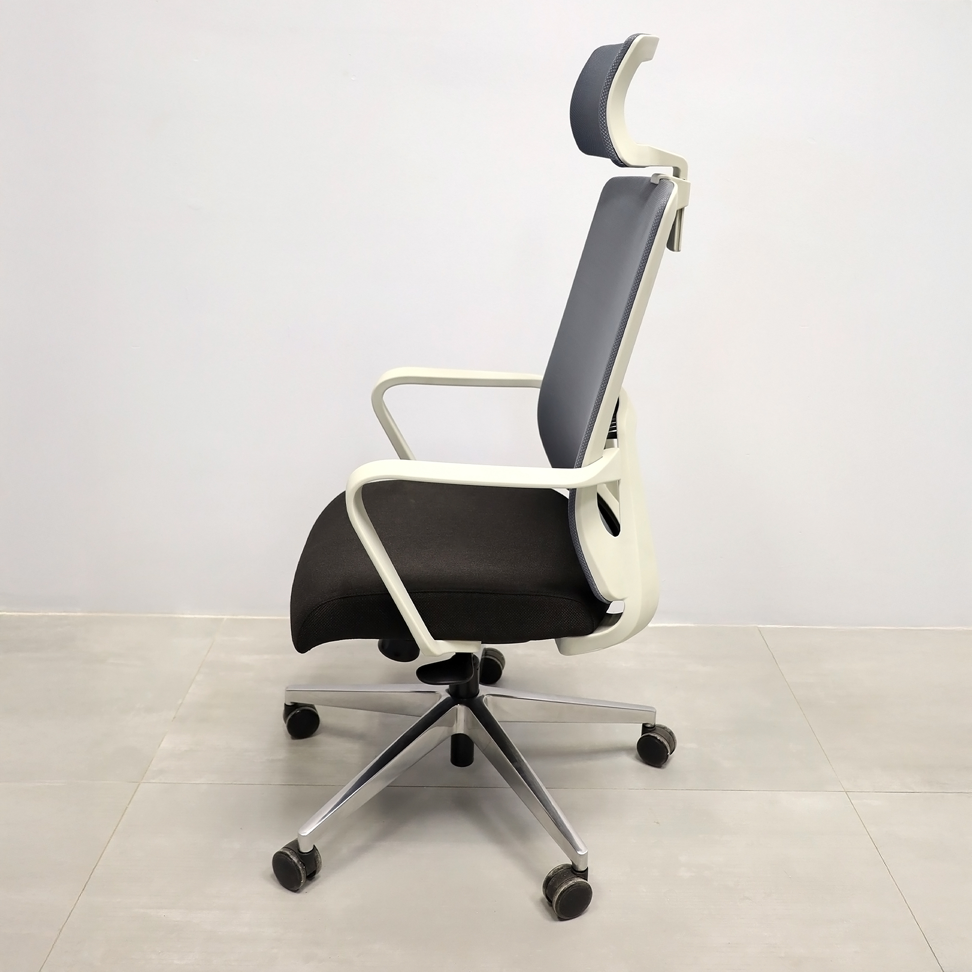 Terra Office Chair with Fixed Arms in light gray mesh back and black fabric seat cushion, shown here.